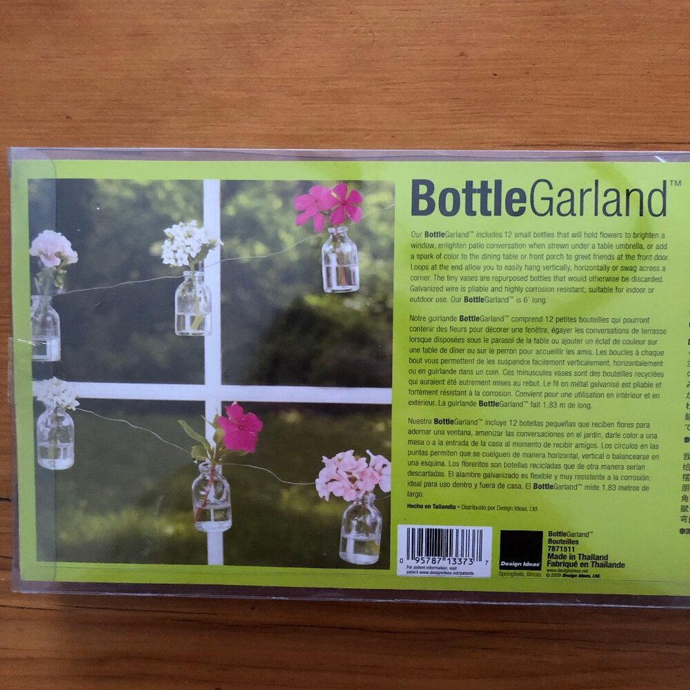 Brand new, unopened mini glass bottles garland
